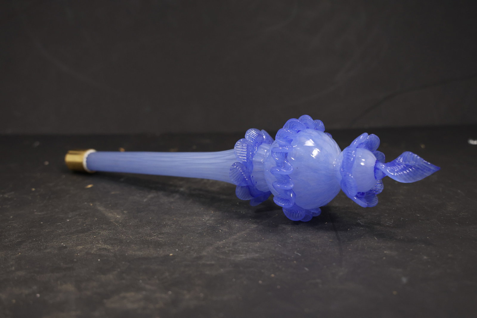 Blue Murano Glass Floral Chandelier Finial: Single vintage mid century blue Murano glass floral chandelier finial from confirmed importer stock. Photographs show an elongated opaline blue body with layered flower forms a tapered point and metal
