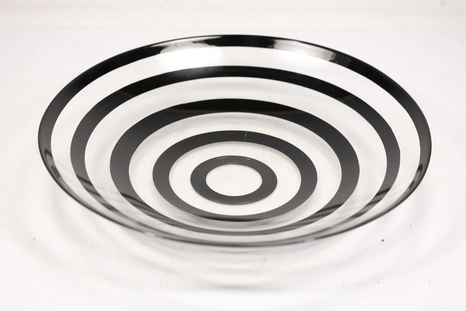 Anne Nilsson for Orrefors Sweden Clown Glass Centerpiece Bowl Black Circles Rings: Anne Nilsson for Orrefors Sweden Clown Glass Centerpiece Bowl Black Circles Rings. 2.5h 15w S:O** Important Auction information:**** All lot descriptions in this auction were generated using artificia
