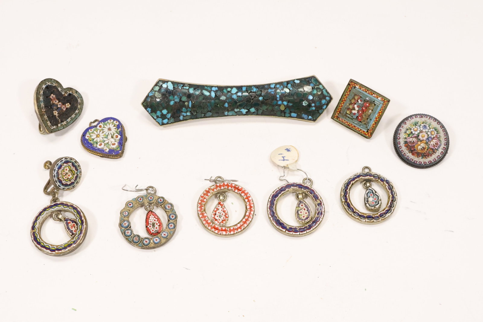Turquoise Inlay Pin and Italian Micro Mosaic Jewelry Group: A ten piece jewelry group includes one long turquoise inlay pin and nine micro mosaic earrings pendants and pins. Tiny colored tesserae form floral and geometric designs within metal settings while