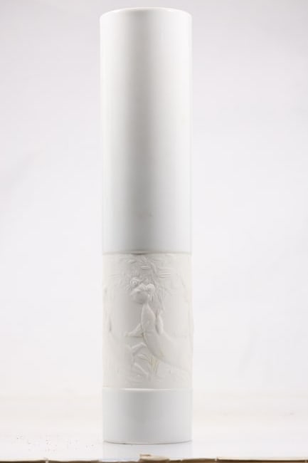 Winterling Bavaria White Porcelain Column Vase: Tall white porcelain vase with narrow cylindrical body and subtle relief decoration. The underside bears a green Winterling Bavaria maker mark. The modeling relates to European decorative porcelain