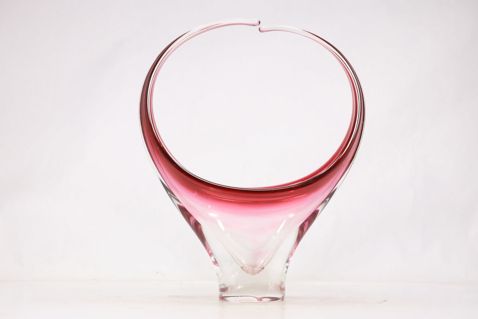 Pink and Clear Cased Art Glass Bowl Vase: Large pink and clear cased art glass vessel with spherical body wide open mouth and thick rounded rim. The layered color creates a luminous modern studio glass form. The form relates to twentieth