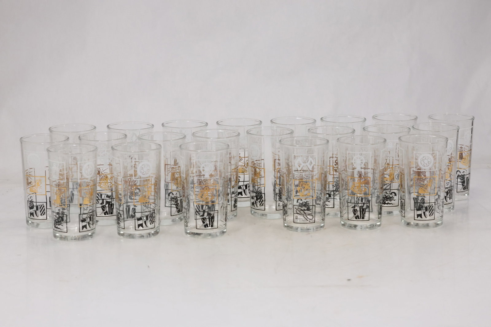 Set of Twenty Two Cut Crystal Cordial Glasses: Set of twenty two matching clear crystal cordial glasses with faceted bowls slender stems and small circular feet. The repeated cut pattern creates a coordinated drinkware service. The form relates