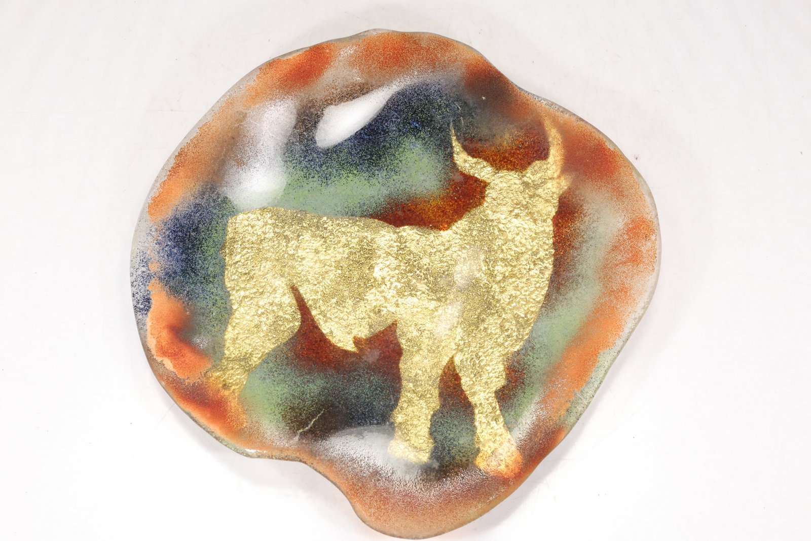 Signed Ceramic Bull Motif Wall Platter: Large round ceramic wall platter with boldly modeled bull head and multicolor glaze in cream red green and black. The reverse bears an artist signature visible in the photographs. The form relates to 