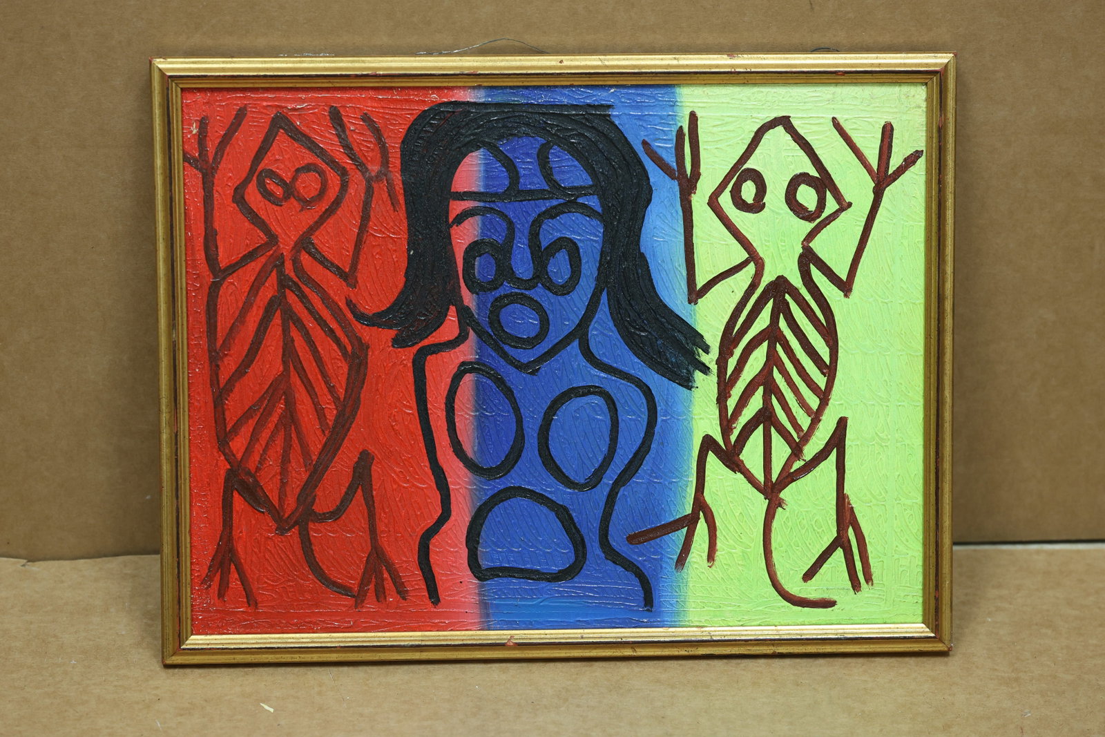 Primary Color Figurative Geometric Abstract Painting: Framed abstract painting with a simplified figure divided by red blue green yellow and black vertical bands. No readable artist signature is visible in the reviewed photographs. The structured color a