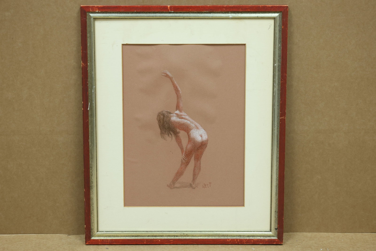 West Signed Red and White Nude Figure Drawing: Framed nude figure drawing in white and red chalk or pastel on red paper. The work is signed West. The simplified figure and expressive color relate to modern figurative art associated with Amedeo Mod