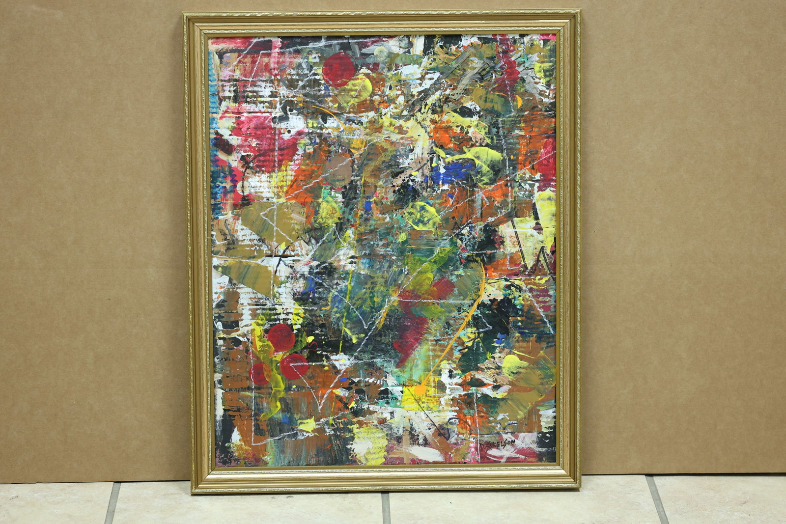 Sakelson Signed Multicolor Gestural Abstract Painting: Framed abstract painting on cardboard with dense layered passages of red yellow blue green and black. The work is signed Sakelson and the reverse also carries black abstract marks. The layered color a