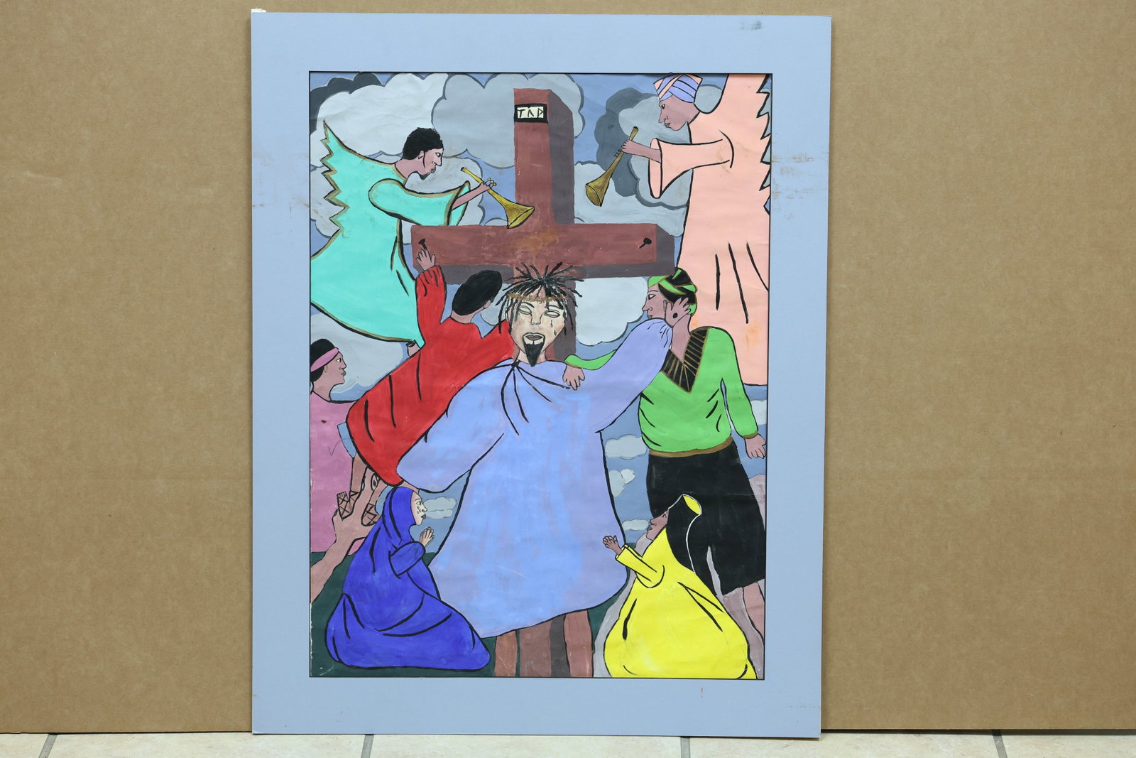 Modern Folk Crucifixion Devotional Painting on Paper: Framed devotional painting on paper depicting the Crucifixion with INRI above the central figure and a group of compressed figures below. No readable artist signature is visible. The compressed figure
