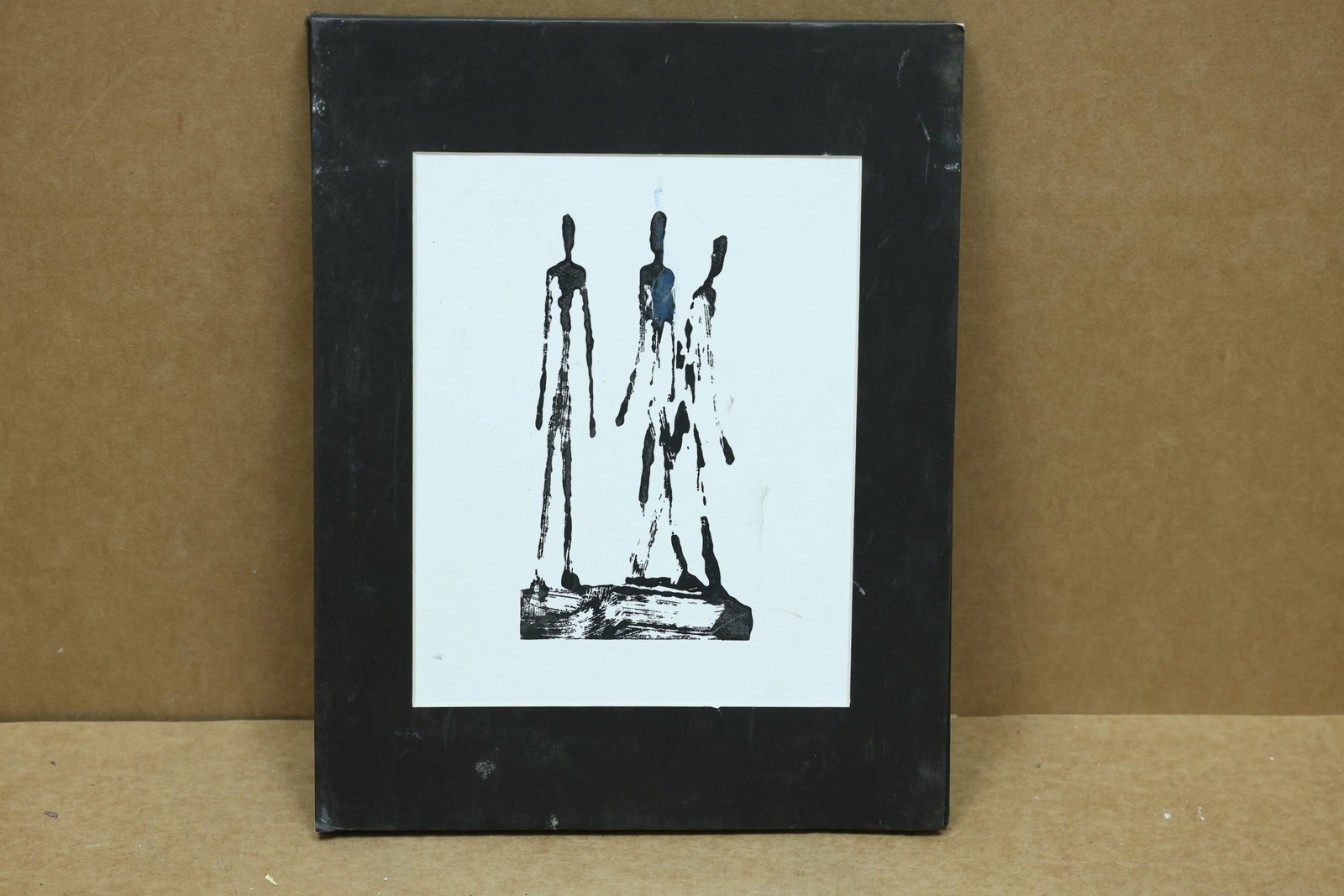 Alberto Giacometti Three Figures Reprint from Original Plate: Framed black and white print depicting three elongated figures from a plate design by Alberto Giacometti. The impression is described as a later reprint from an original plate and no edition number or