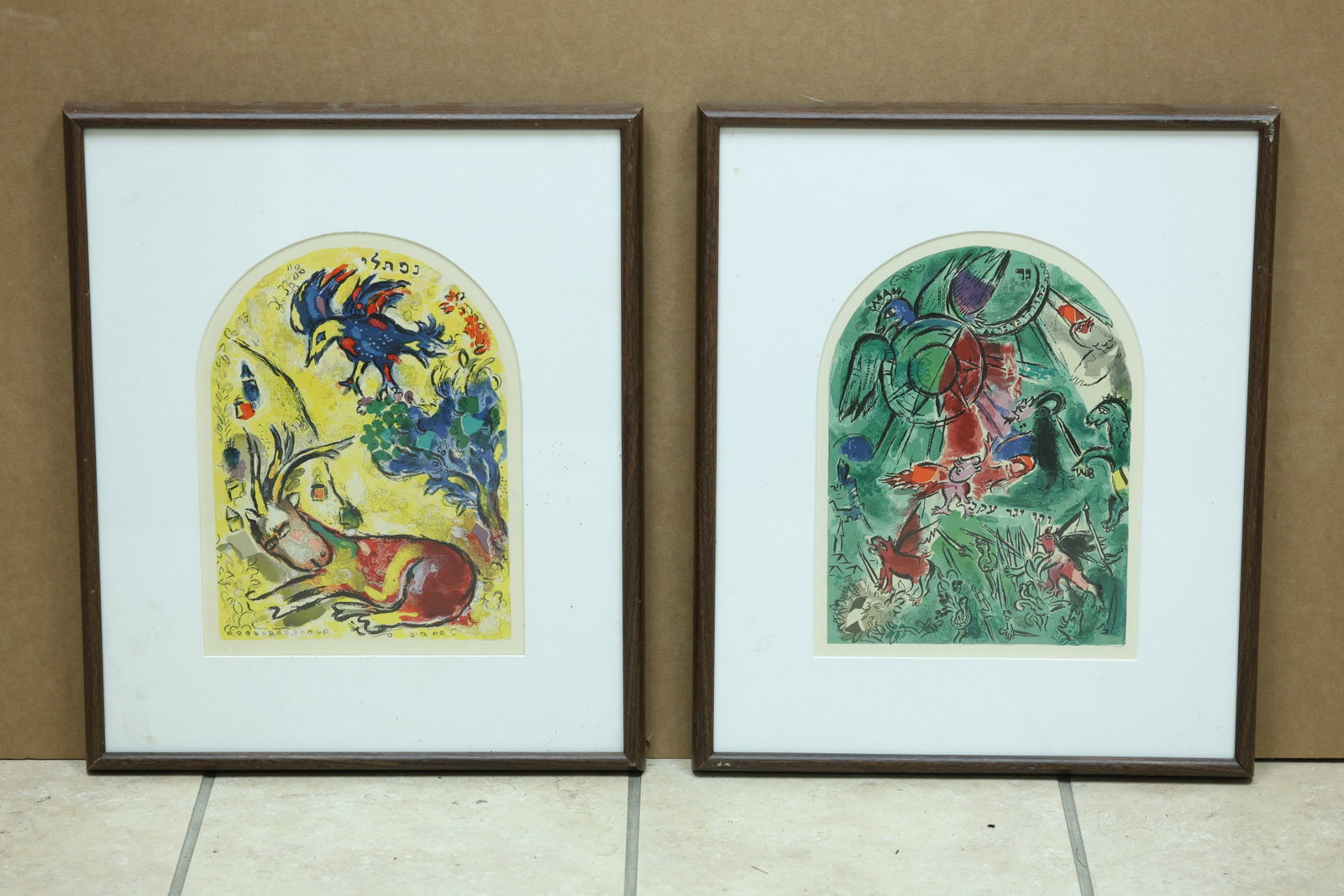 Pair After Marc Chagall Jerusalem Windows Biblical Prints: Framed pair of color prints after designs from the Marc Chagall Jerusalem Windows or Twelve Tribes series. The photographs do not confirm publisher edition or original lithographic status. The imagery