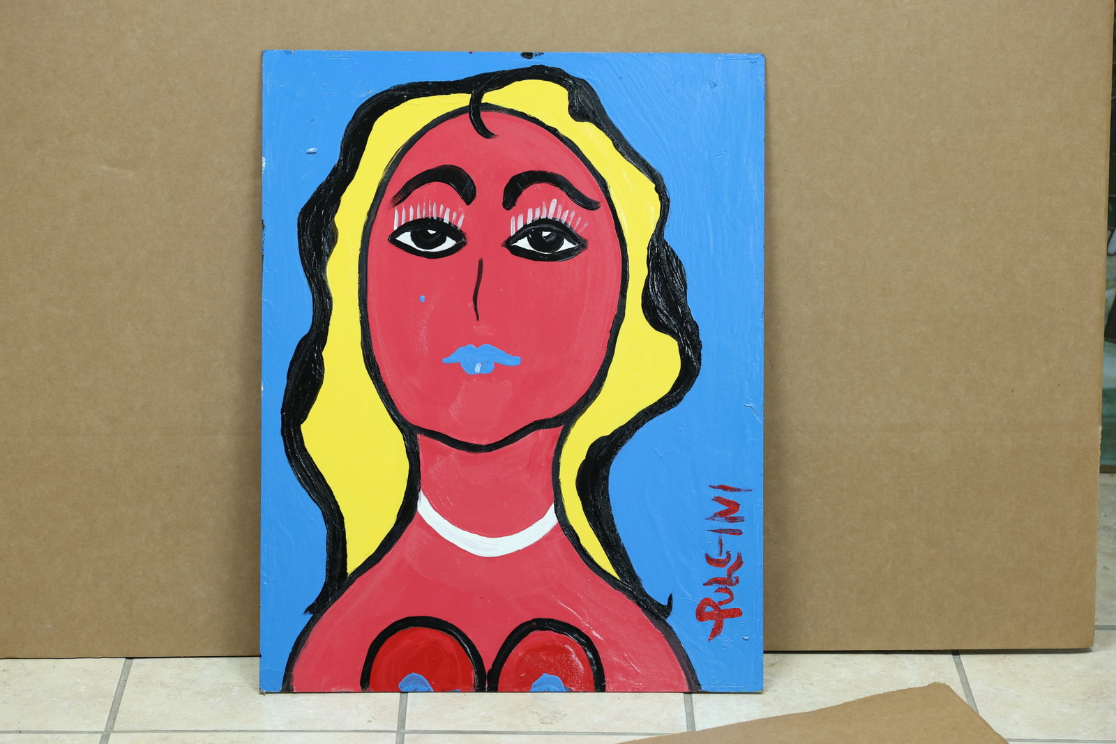 Pulgini Pop Art Blonde Nude Portrait Painting: Framed Pop Art style painting depicting a blonde nude woman against a blue ground. The work is signed Pulgini. The flattened figure and saturated color relate to Pop Art and Neo Expressionism associat