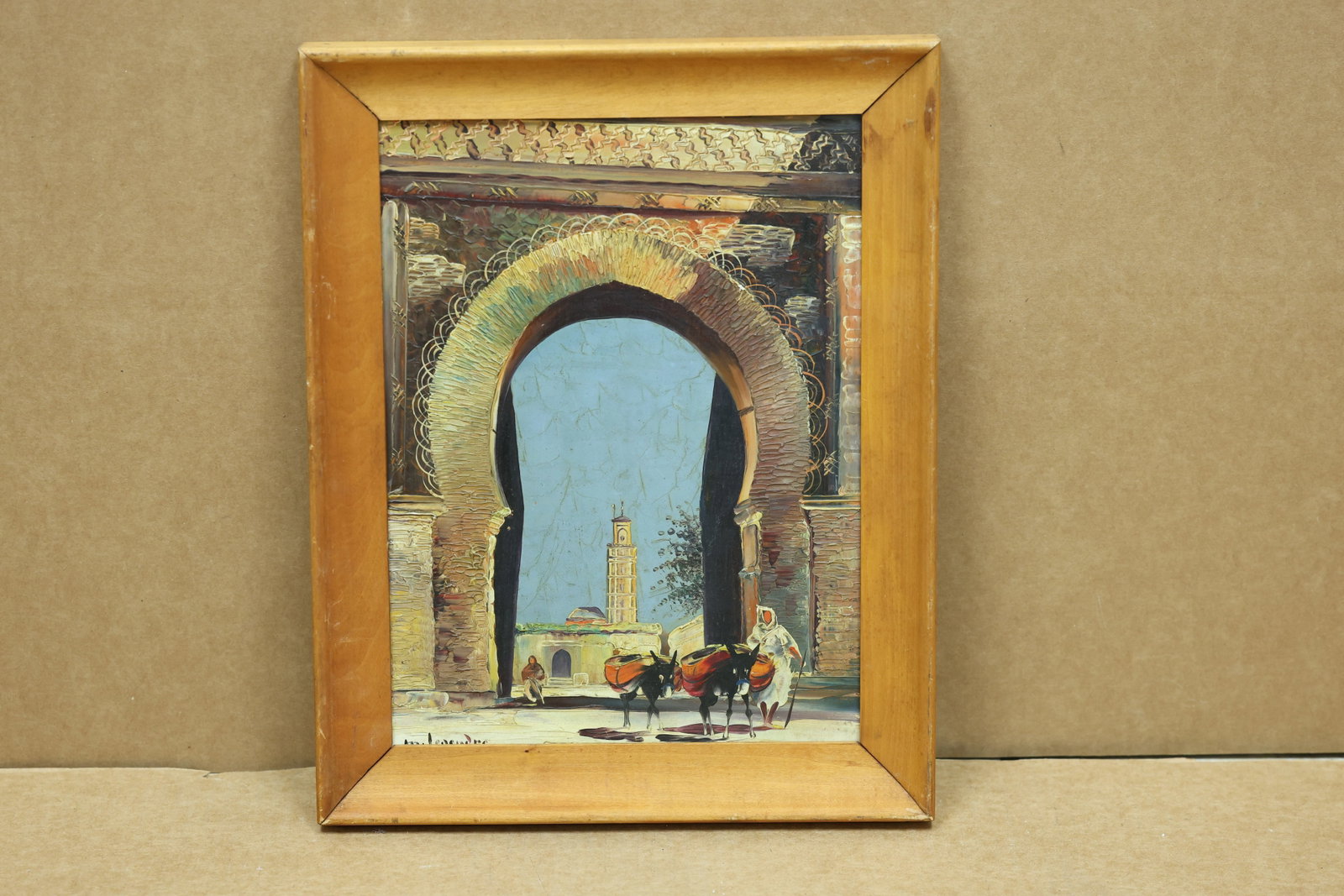 Maurice Legendre Marrakech Archway Oil on Board 1932: Framed oil painting on board depicting a monumental North African archway with a minaret horse and figures. The work is signed Maurice Legendre. A Henri Gallery label from 113 South Royal Street in Al