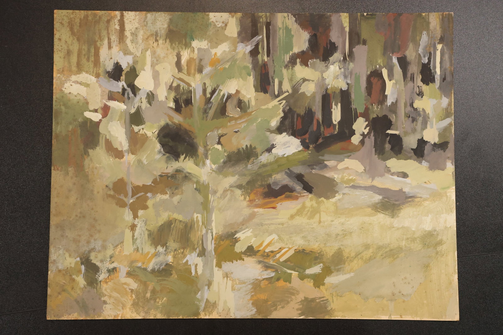 Robert Angeloch Unsigned Woodland Oil Painting on Board: Original oil painting on board by Robert Angeloch depicting a wooded landscape with a pale clearing and layered green brown gray and cream brushwork. The painting is unsigned and was reported as comin