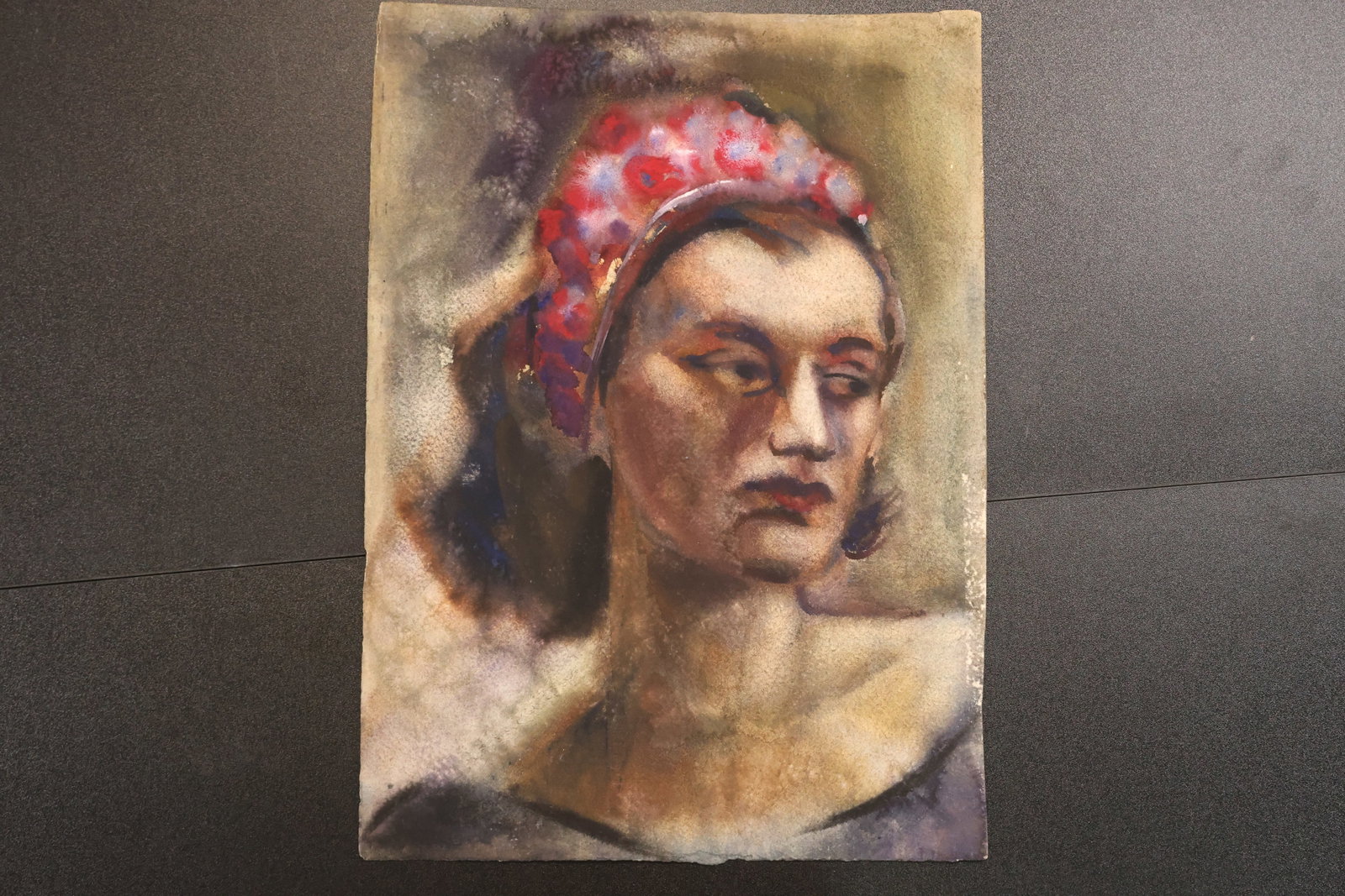 Robert Angeloch Double Sided Portrait and Floral Still Life Painting: Double sided original painting on paper by Robert Angeloch. One side depicts a woman wearing a red patterned head scarf. The reverse depicts a floral still life with yellow orange and violet flowers i