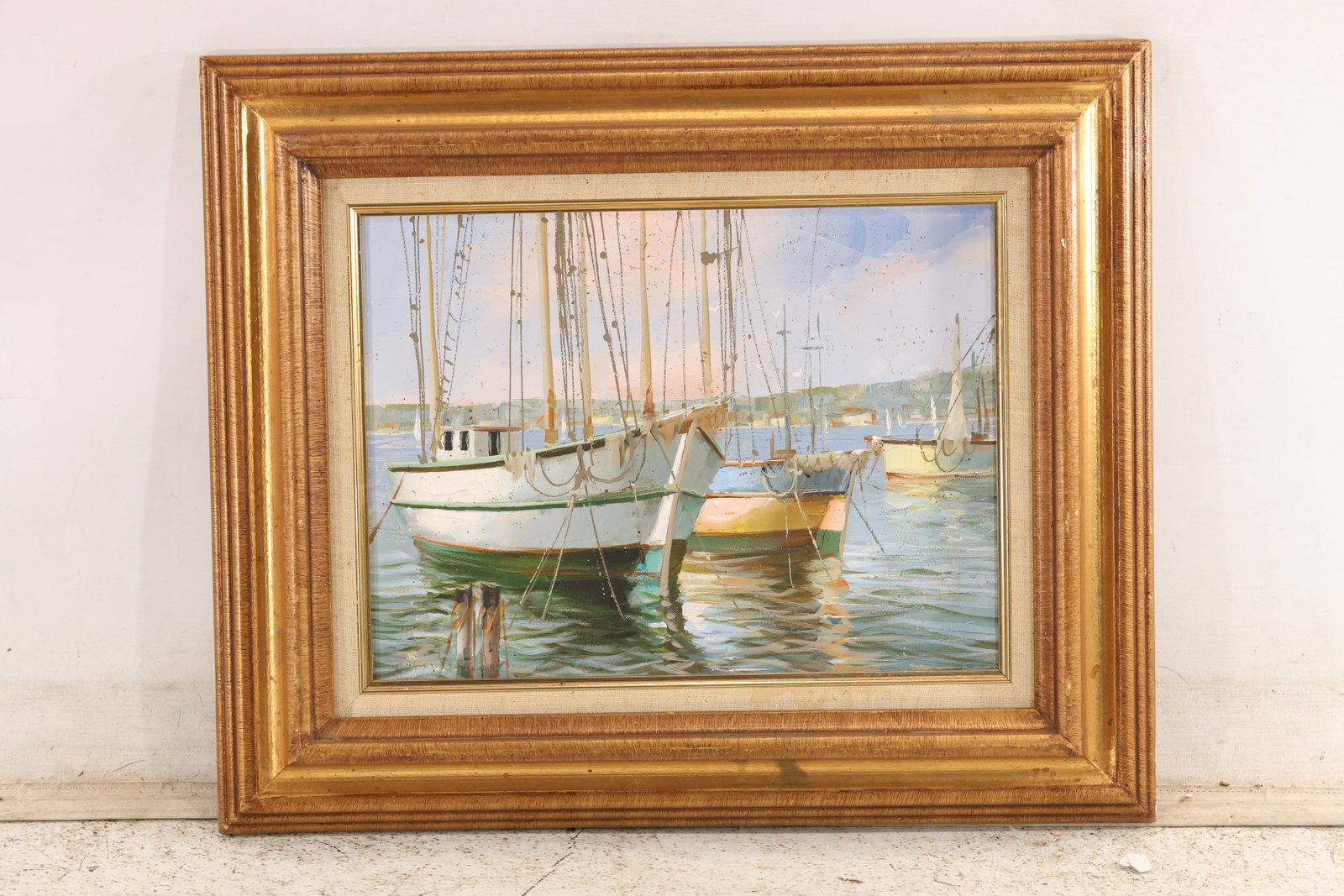 Nidia DAlessandro Marina Sailboats Painting with Artist Label: Framed marina painting associated with Nidia DAlessandro depicting sailboats masts and reflected color across quiet water. The photographed back carries an artist information label and inventory notat