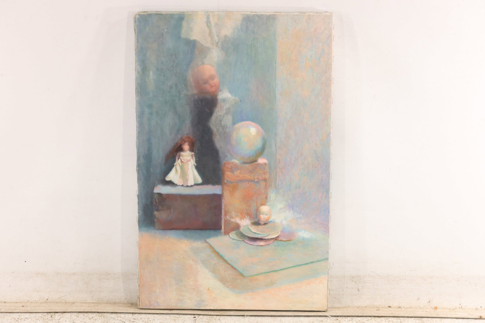 Vintage Doll and Glass Still Life Painting on Canvas: Original still life painting on canvas showing a small doll and reflective glass object arranged against a pale blue and gray interior. The composition uses softened edges and restrained pastel color.