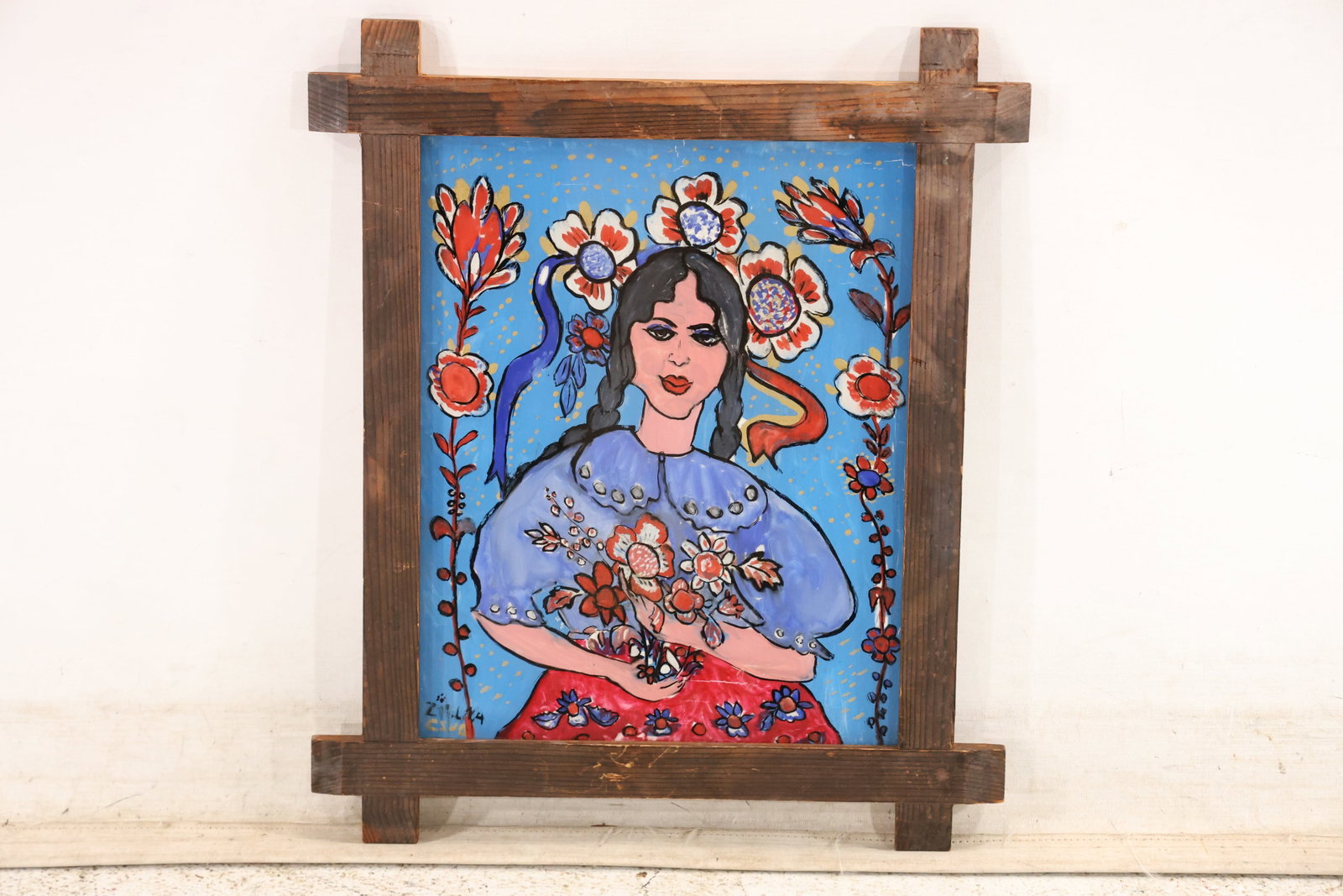 Signed Jan Fudala Polish Reverse Glass Folk Painting: Original reverse painting on glass signed at the lower left and associated with Polish folk artist Jan Fudala. The image presents a colorful female figure framed by floral motifs in a rustic carved