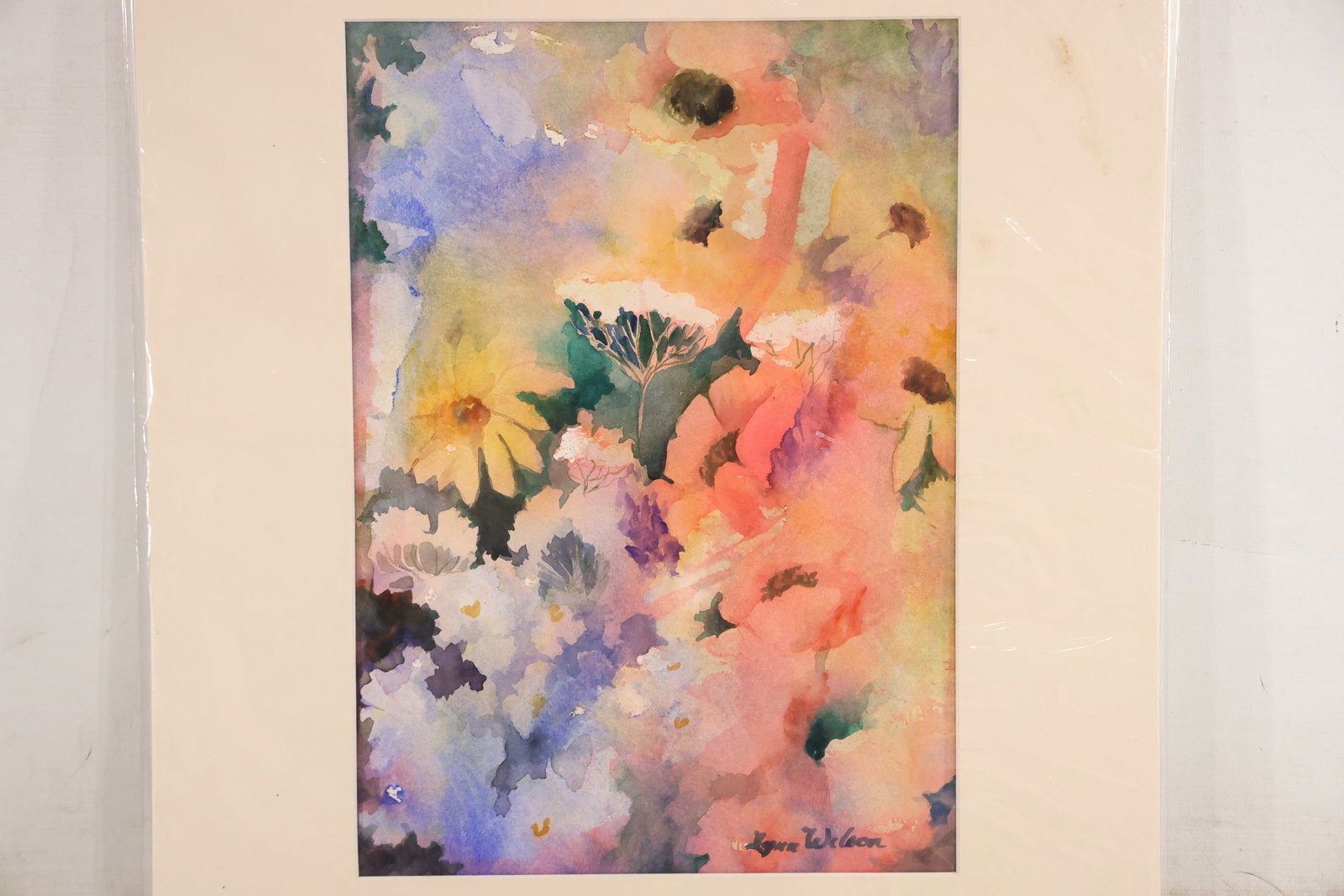 Signed Lynn Wilson Colorful Floral Watercolor Painting: Original watercolor on paper signed Lynn Wilson at the lower right. Loose pink orange yellow green and blue washes form an abstracted floral arrangement on a light ground. The transparent color and op