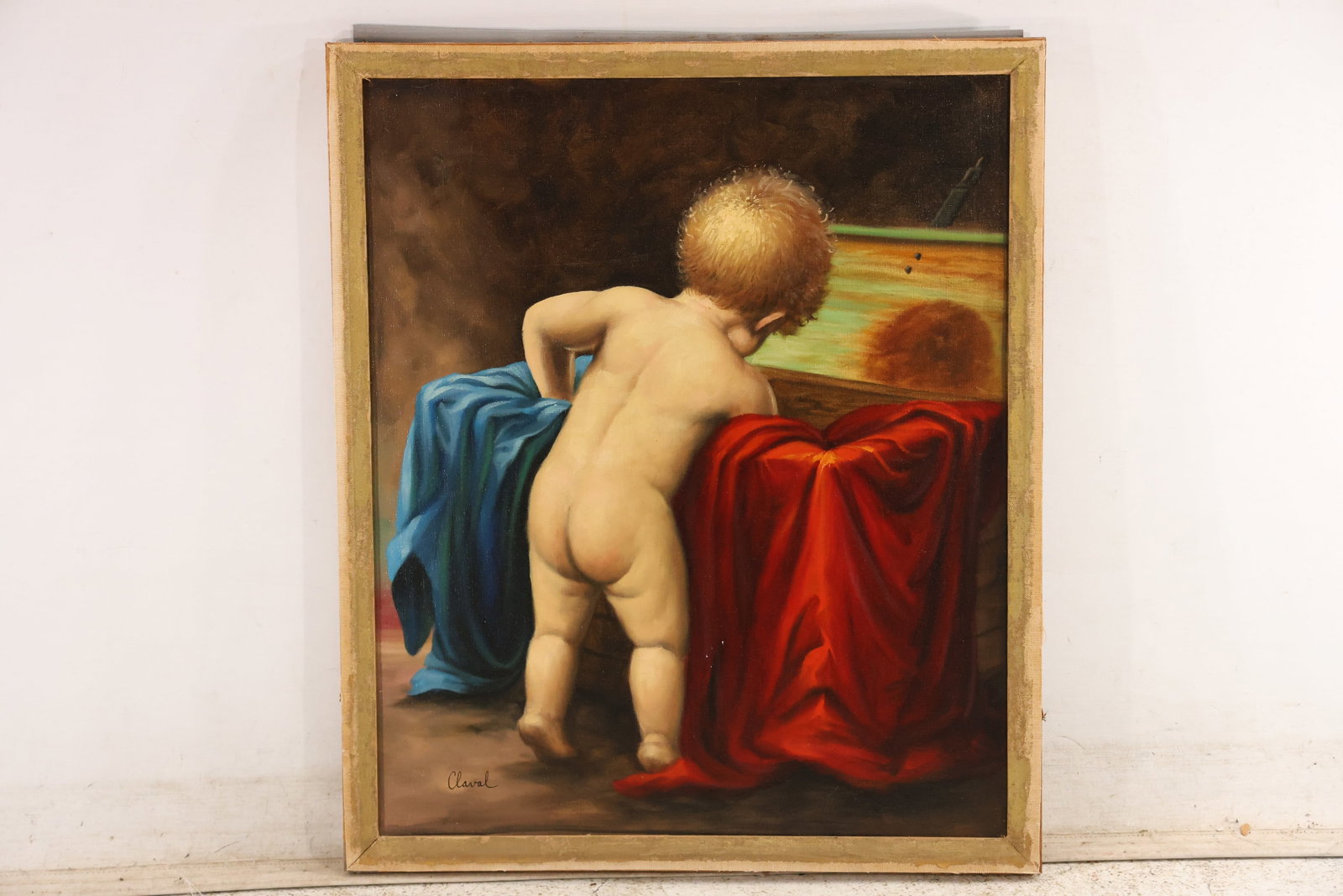 Signed Classical Child with Drapery Oil Painting: Vintage oil painting on canvas signed at the lower left with an unresolved name. The classical style scene depicts a nude child beside rich red and blue drapery with carefully modeled flesh and