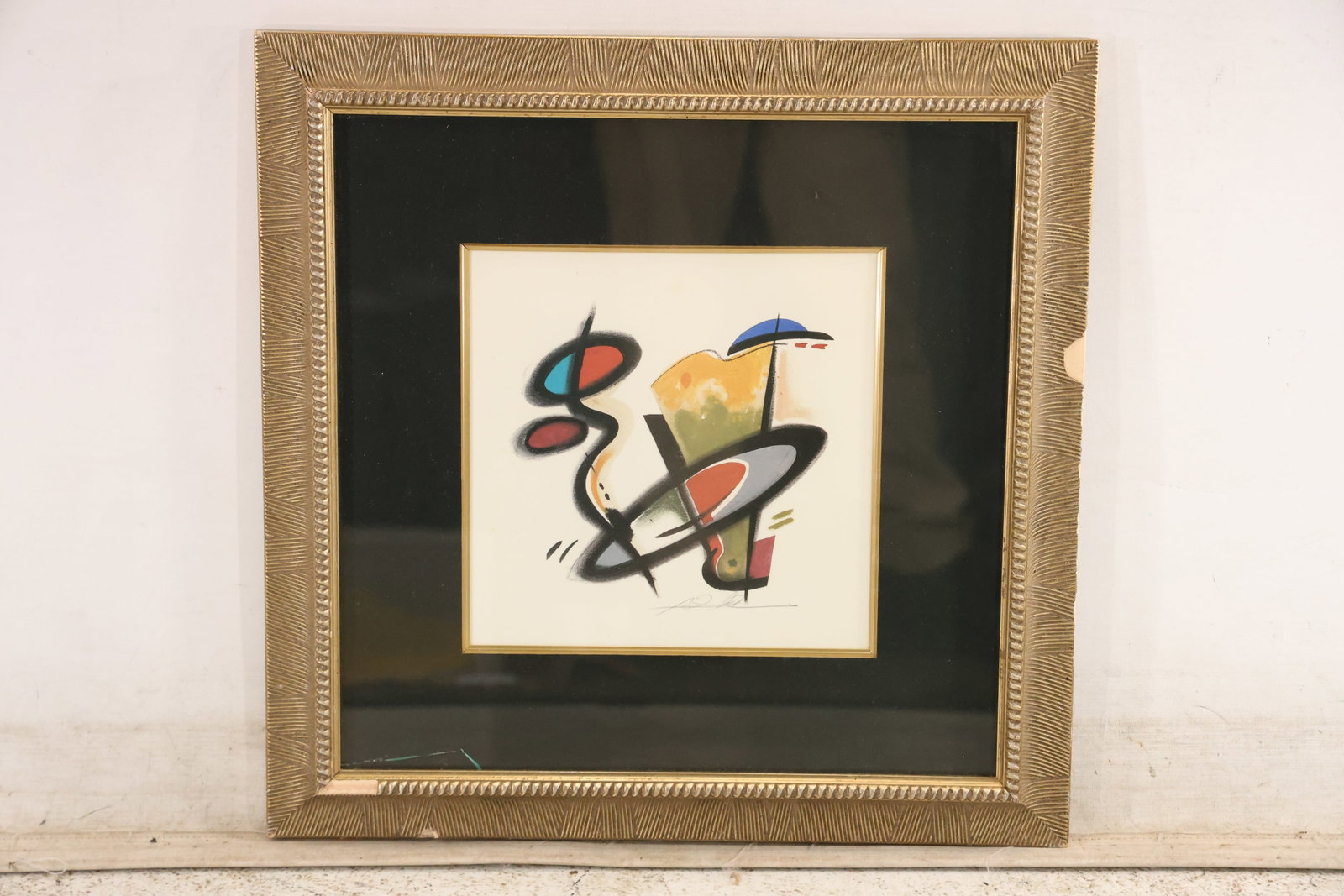Mid Century Geometric Abstract Color Print: Framed abstract color print composed of black red blue yellow and cream geometric forms. No confirmed artist attribution is visible in the photographs and the source note records broken glazing. The i