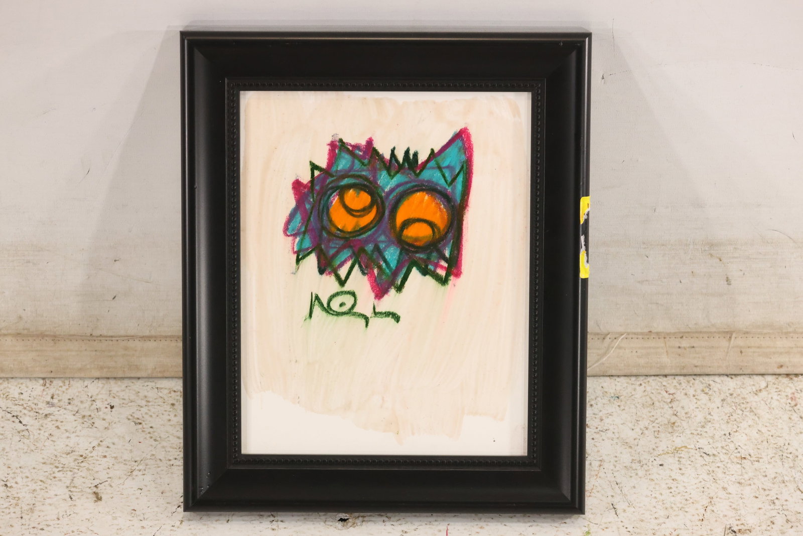 Wayne Cunningham Signed Colorful Monster Abstraction: Signed mixed-media artwork featuring an angular monster-like face with orange eyes, bright green, blue, and pink accents, and lettering below. Presented in a black frame. Artwork measures 10 x 8