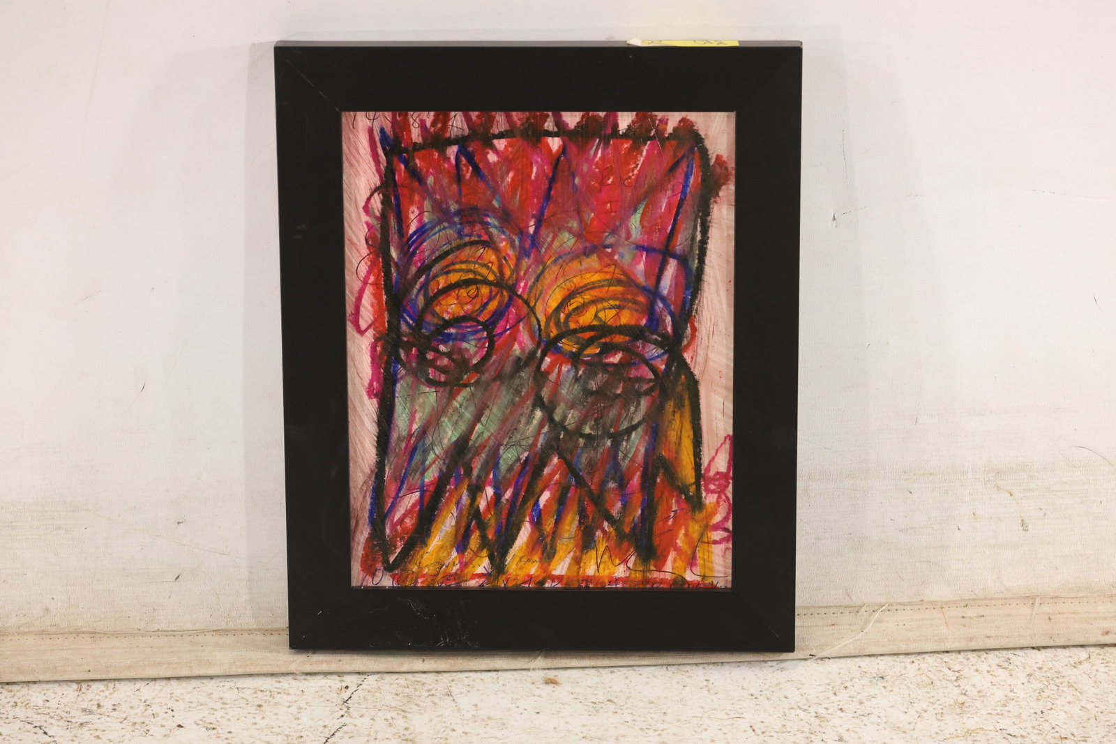 Wayne Cunningham Signed Expressive Face Abstraction: Signed mixed-media artwork featuring a large, densely worked face in layered red, orange, blue, and black marks. Presented in a black frame. Artwork measures 10 x 8 inches. Outside frame measures 13 x