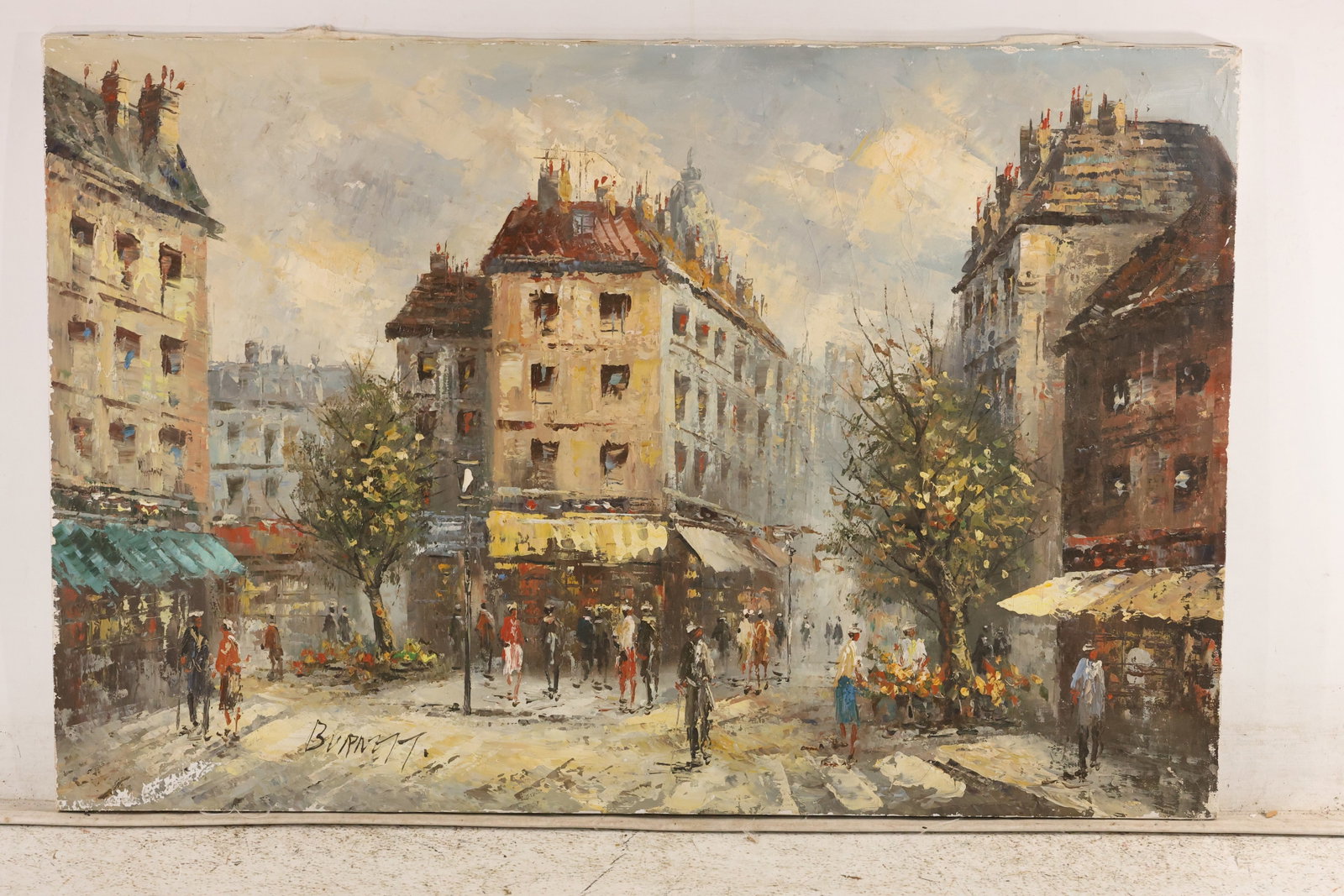 Signed Burnett Paris Street Scene Oil on Canvas: Oil on canvas depicting a Parisian street with storefronts, awnings, trees, and pedestrians. Thick impasto brushwork. Signed “Burnett” lower left. Artwork measures 24 x 36 inches. **Pickup Not