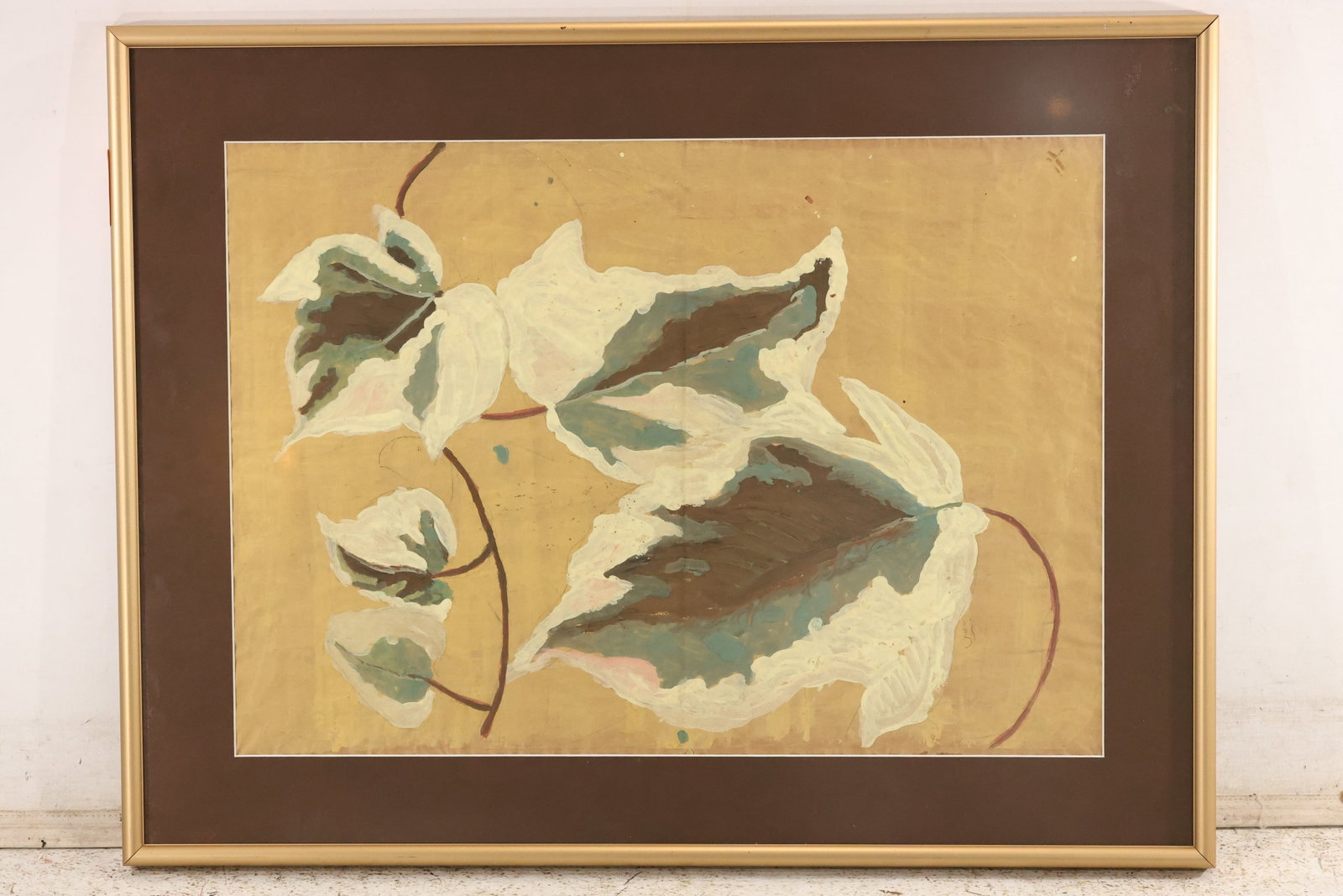 Modern Botanical Leaf Painting on Paper: Botanical painting on paper with variegated foliage in white, brown, green, and reddish tones against a golden-yellow background. Framed. Artwork measures 17 x 24 inches. Outside frame measures 23 x 3