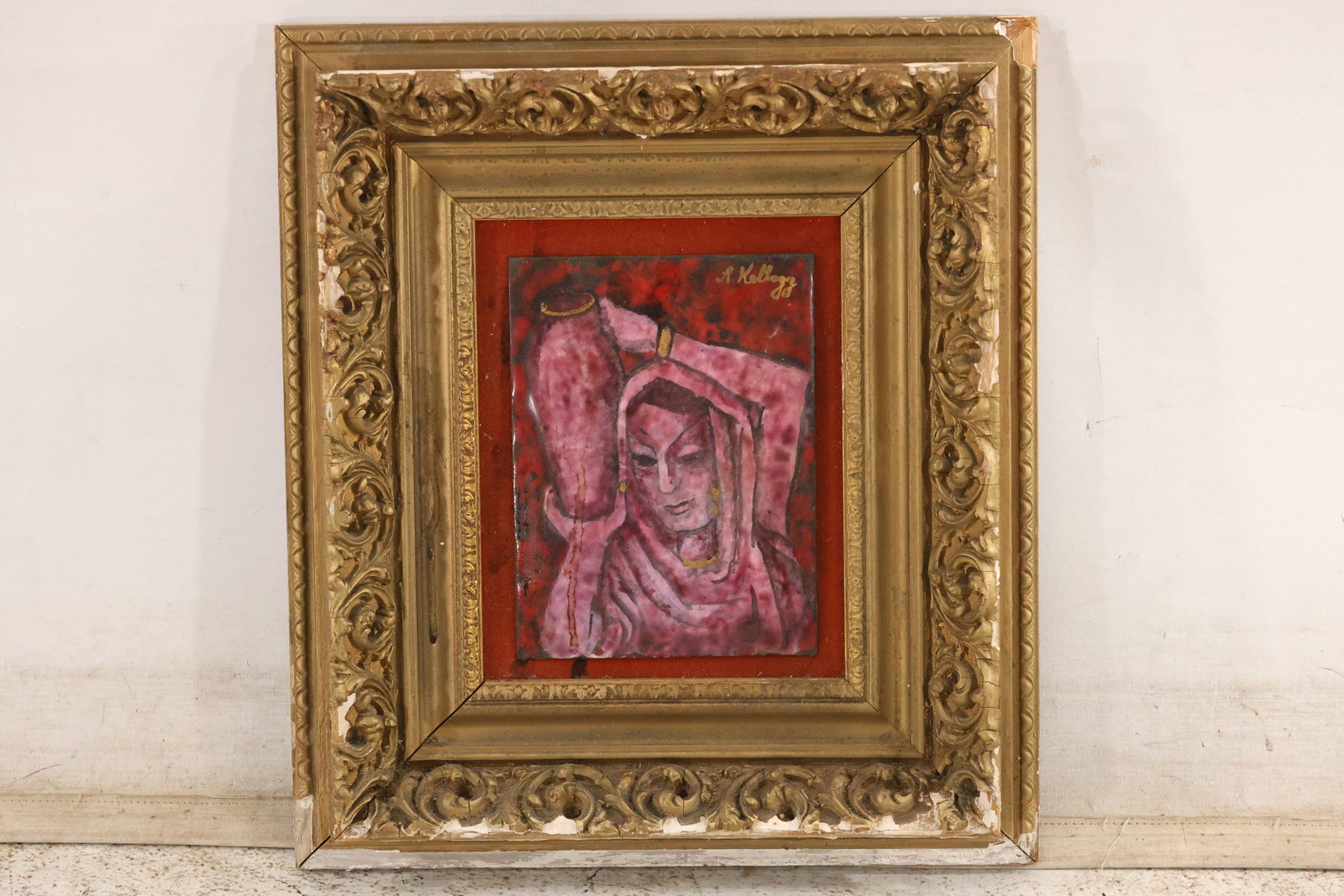 A. Kellogg Signed Enamel on Copper Figural Artwork: Enamel on copper featuring a stylized angular figure in pink and dark tones against a crimson background. Signed “A. Kellogg” in gold script at upper right. Presented in an ornate gold-toned f