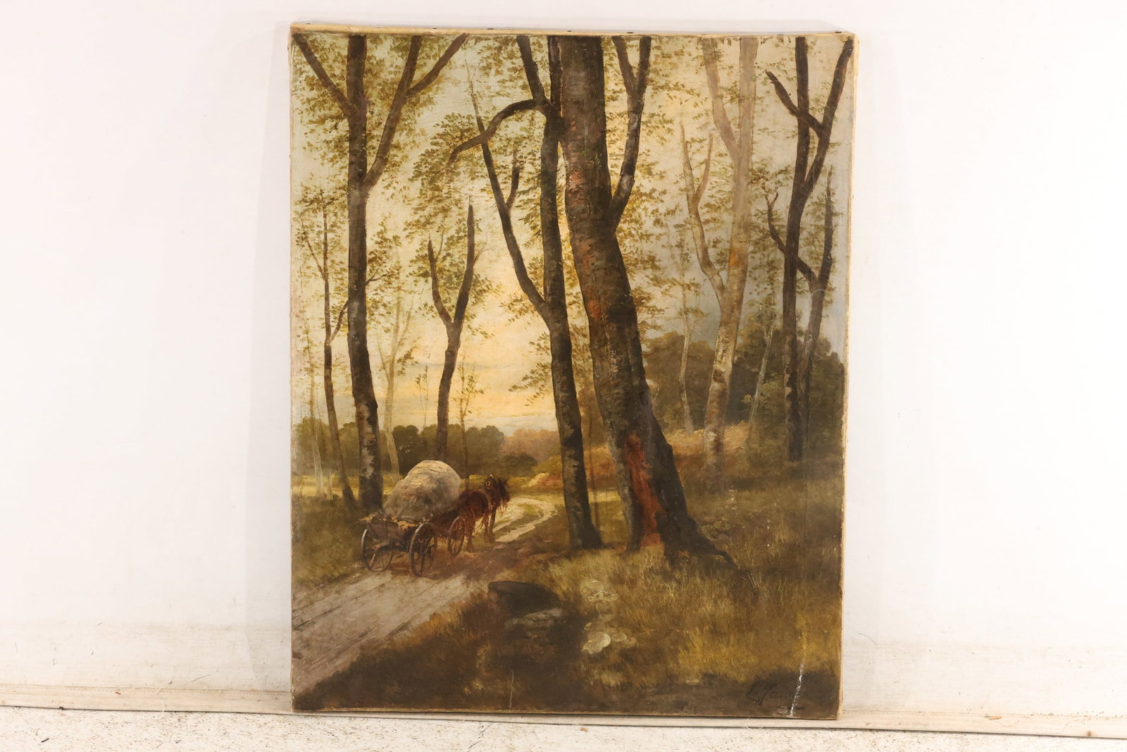 Signed L. Farallo Woodland Landscape Oil Painting: Oil on canvas depicting a wooded landscape with a loaded cart on a dirt road in sunset or dawn light. Signed “L. Farallo” lower left. Canvas has been relined. Artwork measures 27 x 22 inches. 