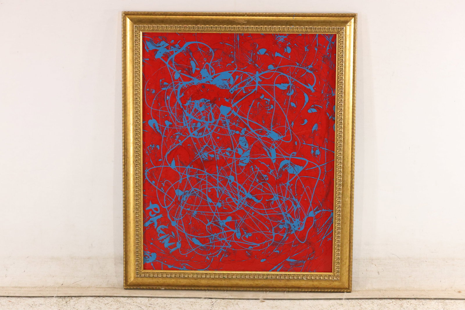 Thomas Pulgini Blue Drip Abstraction on Red Painting: Original painting by Thomas Pulgini. Fine looping blue lines form a web across a bright red ground. Presented in a gold-toned frame. Size: 20 x 16 inches. Outside frame measures 24 x 20 inches. Shelf 