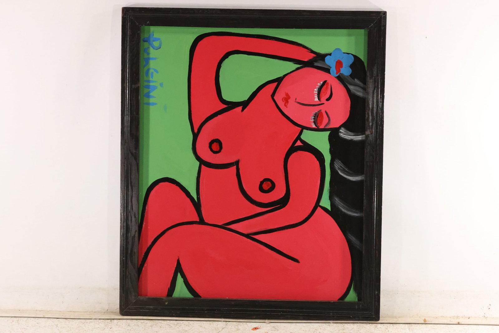 Thomas Pulgini Reclining Red Figure on Green Painting: Original painting by Thomas Pulgini. A reclining red figure with one arm raised, black hair with white bands, and a blue flower near the head against a green background. Presented in a black frame. Si