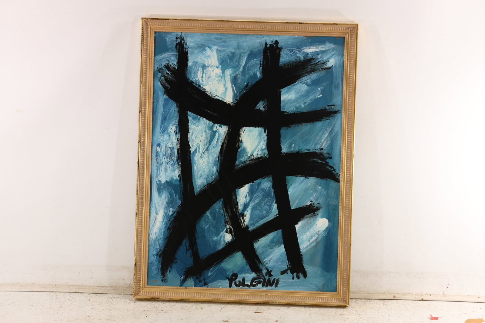 Thomas Pulgini Black Gesture Abstraction on Blue Painting: Original painting by Thomas Pulgini. Broad intersecting black strokes stand against a textured blue-and-white ground. Presented in a gold-toned frame. Size: 32 x 24 inches. Outside frame measures 35 x
