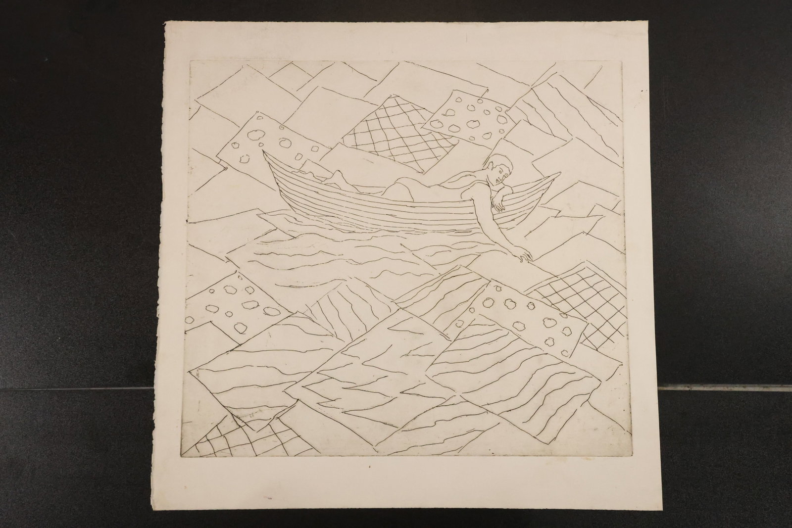 Figure in a Boat Woodblock Print: Woodblock print on paper depicting a figure in a small boat amid angular waves, geometric shapes, and patterned forms. Size: 22 x 22 inches. Shelf ID: mc1 **Pickup Notice:** This item requires a confi