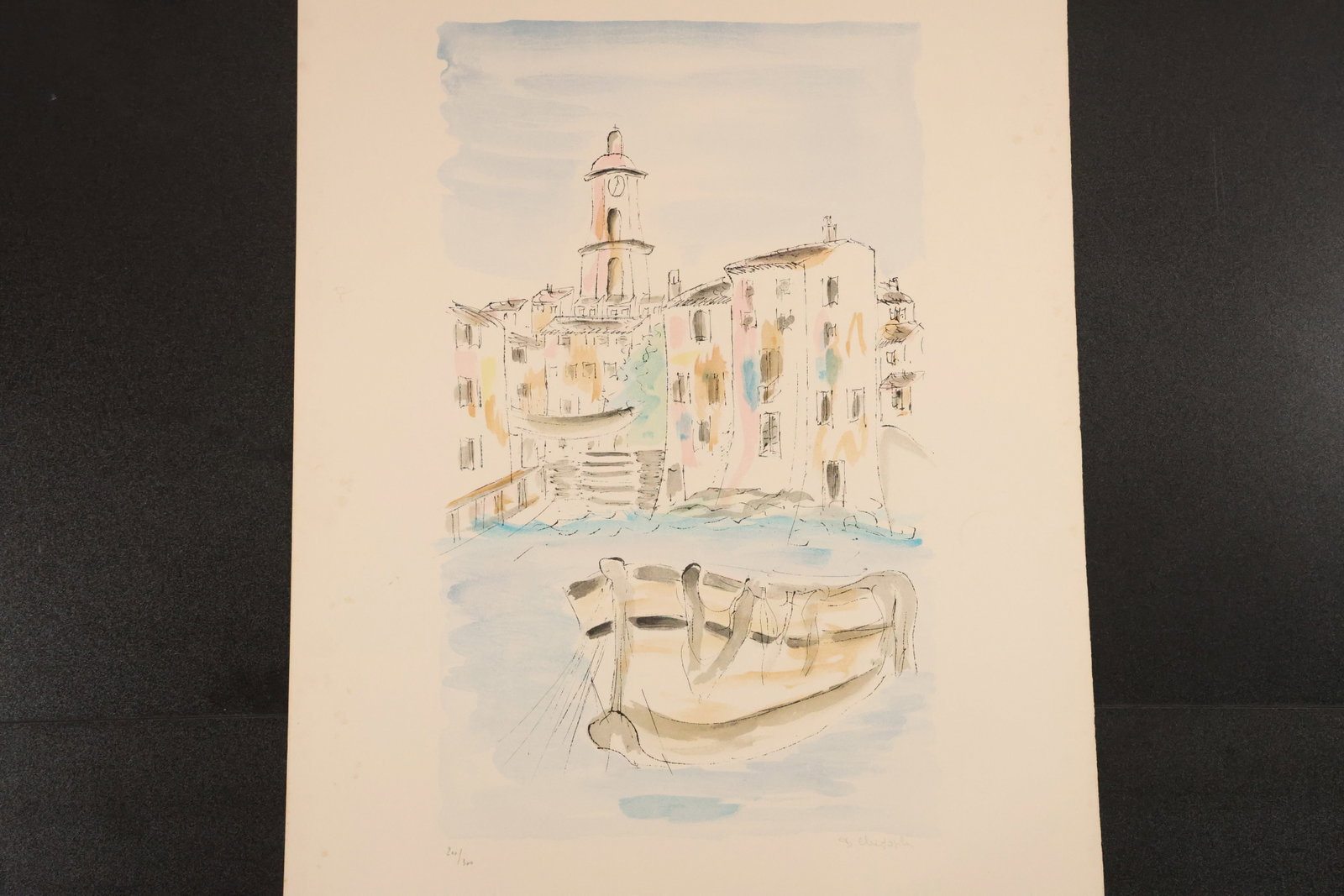 Signed and Numbered Venice Canal Lithograph: Color lithograph depicting a canal-side scene with a boat, waterfront buildings, and a tower, rendered in light, watercolor-like tones. Signed and numbered in pencil. Size: 26 x 19 inches. Shelf ID: m
