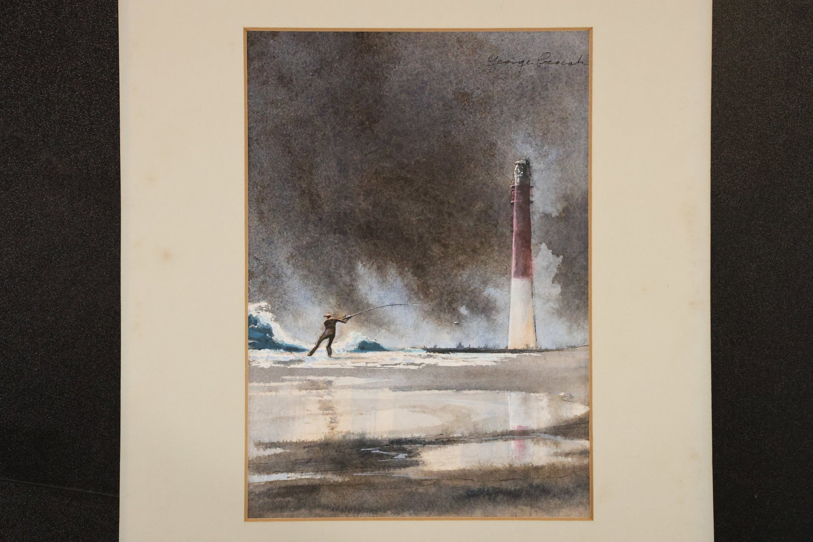 Signed Lighthouse and Fisherman Watercolor: Watercolor depicting a small figure beside the water and a tall lighthouse beneath a dramatic dark sky. Signed at upper right and presented with a light-colored mat. Size: 7 x 10 inches; outside mat: 