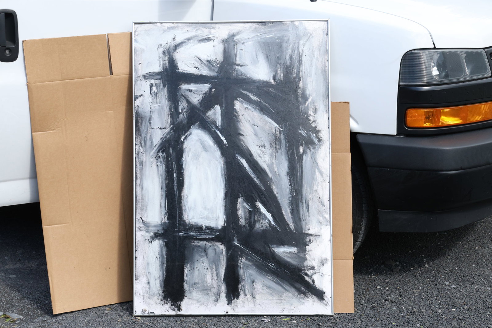 Thomas Pulgini Large Black-and-White Gesture Abstraction Painting: Original painting by Thomas Pulgini. Broad intersecting black strokes over a gray-and-white ground. The canvas shows bubbling noted in the catalog. Size: 34 x 48.5 inches. Shelf ID: SU1 S5 **Pickup No