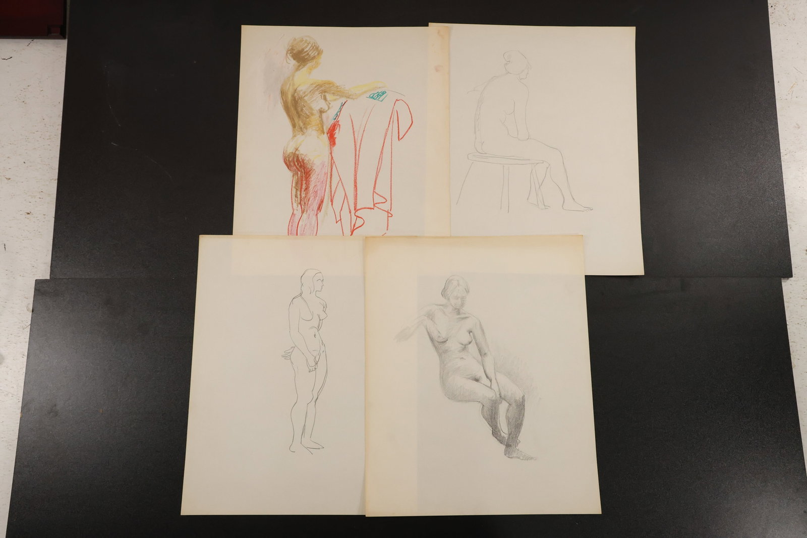 R. Angeloch Group of Four Figure Drawings: A group of four figure studies on paper by R. Angeloch, including seated and standing female subjects. The studies range from delicate outlines to shaded drawing and color accents. Size: 17 x 14 inche