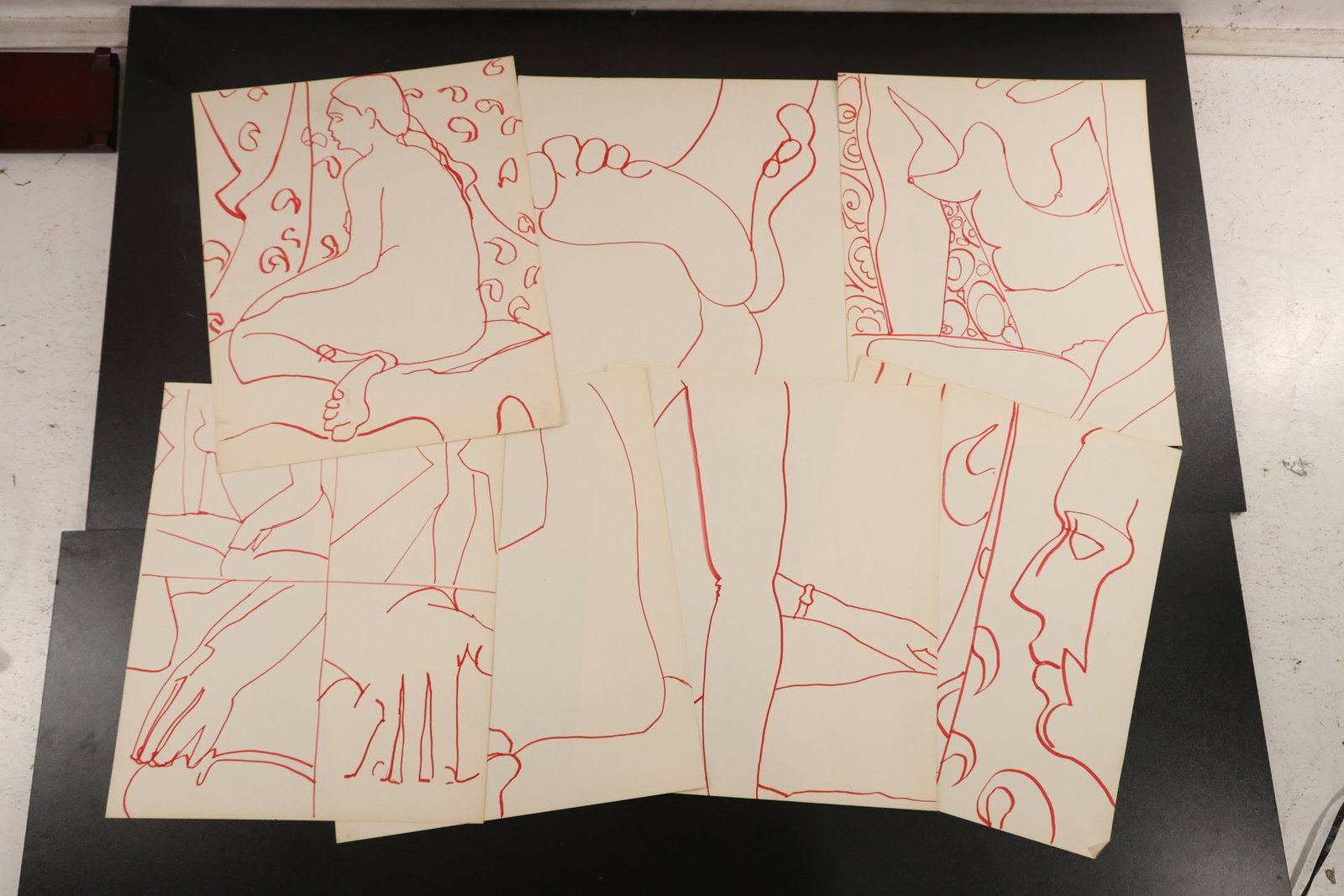 R. Angeloch Group of Seven Red Line Drawings: A group of seven drawings on paper by R. Angeloch, executed in flowing red lines. The compositions feature loosely outlined figures and abstract forms. Size: 14 x 17 inches. Shelf ID: abx **Pickup Not