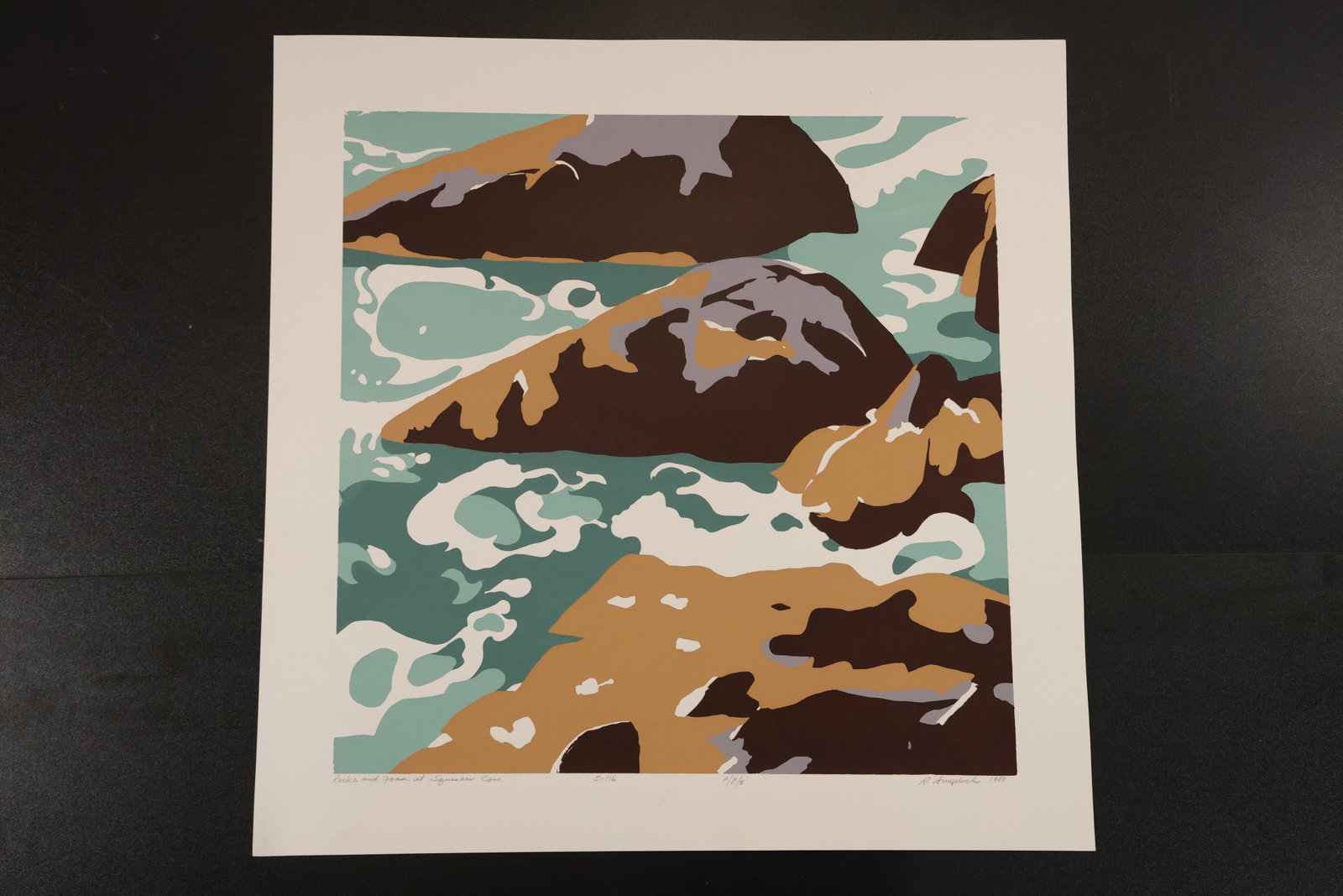 R. Angeloch Signed Turquoise Surf and Rocks Color Print: A signed coastal color print by R. Angeloch featuring turquoise water and white foam around large brown and ocher rocks. Broad flattened shapes create a rhythmic shoreline composition. Size: 22.5 x 22