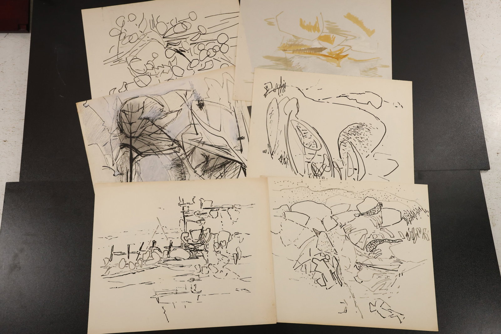 R. Angeloch Group of Abstract and Landscape Drawings: A group of works on paper by R. Angeloch, featuring loose botanical shapes, angular landscape studies, and a pale yellow composition. Includes the drawings shown together. Size: 14 x 17 inches. Shelf 