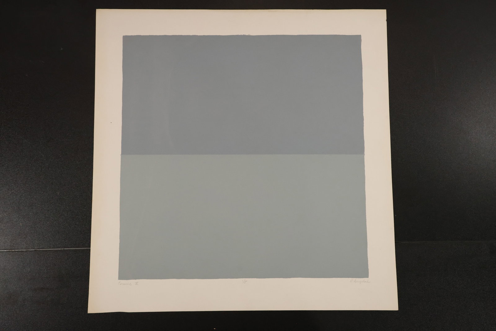 R. Angeloch Two-Tone Gray Abstract Print: A print by R. Angeloch featuring two broad horizontal fields of muted gray within a light paper margin. The restrained geometric composition emphasizes subtle tonal contrast. Size: 22 x 22 inches. She