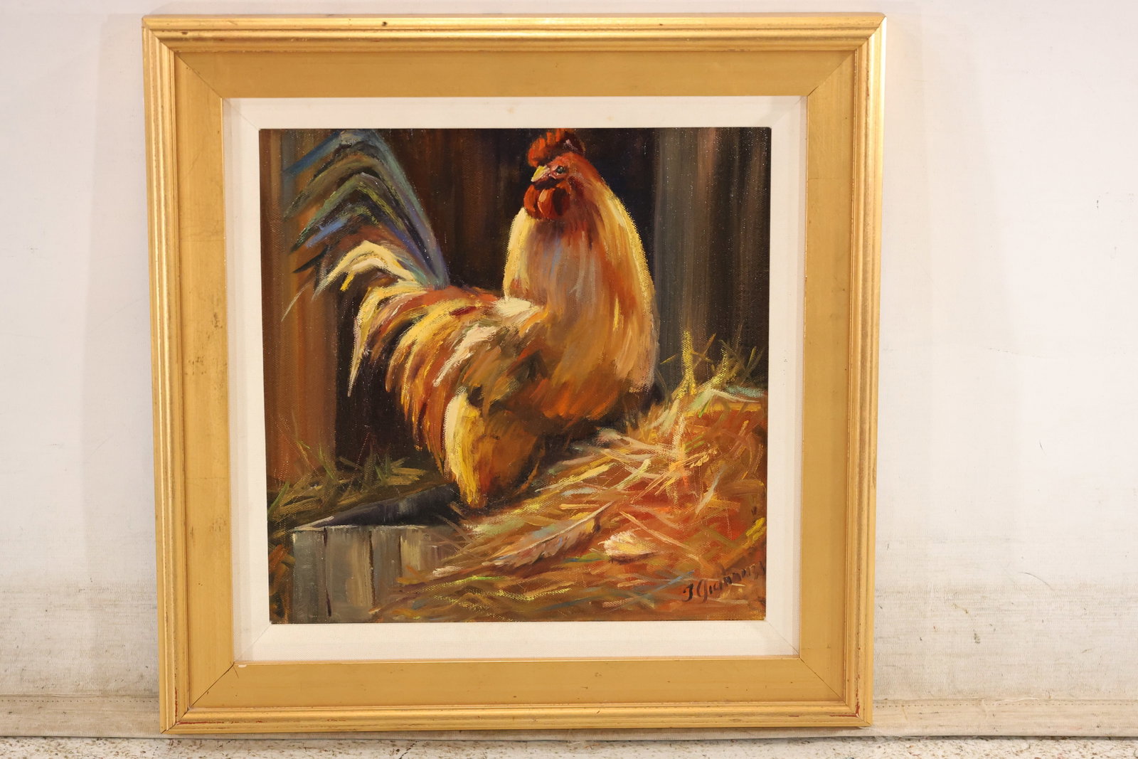 J. Giannuzzi Signed Rooster Oil Painting: An oil painting on canvas signed "J. Giannuzzi" at lower right. A rooster with a red comb and golden-brown plumage stands on straw against a dark barn-like background. Broad, textured strokes describe