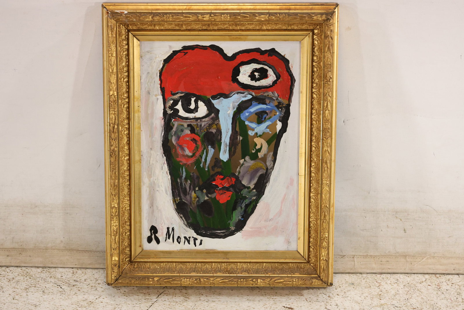 R. Monti Signed Abstract Face Painting: A boldly colored painting on canvas signed "R. Monti" at lower left. The mask-like face combines oversized eyes, a pale blue nose, red hair, and patches of green, black, and white. Thickly worked
