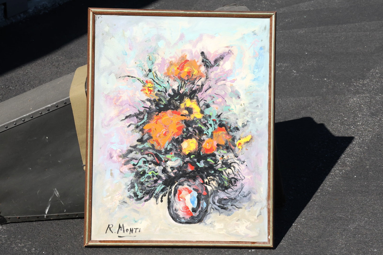 Rocco Monticolo (R. Monti) Orange and Yellow Floral Still Life Painting: Painting by Rocco Monticolo (R. Monti). A vase of orange and yellow flowers is surrounded by dark green foliage and loose black accents. Pale pink, gray, and cream strokes soften the background and ta