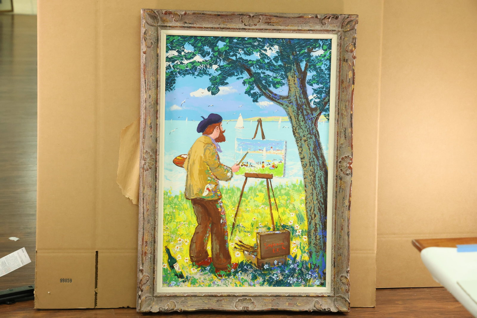 Signed Savarin Painting of an Artist Beside Sailboats: Vertical painting of a bearded artist in a dark beret and yellow coat working at an easel beneath a tree. Sailboats and birds appear over blue water, while flowers surround the figure and paint box. T