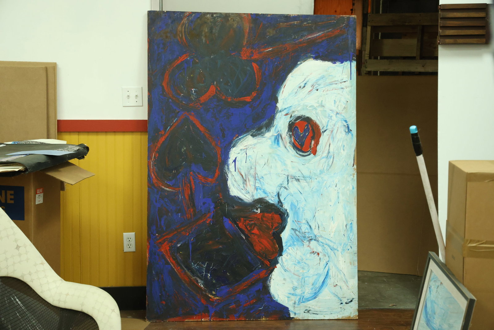 Romantic Possibility Acrylic Painting Inscribed Mark Makela 2001: Large vertical acrylic painting on plywood with a white profile face, red lips and a heart shaped eye beside outlined playing card suit motifs. Dark blue fields and red contours frame the graphic imag
