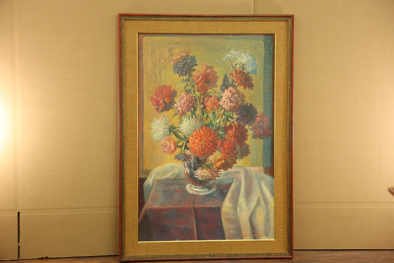 Return From The Garden Floral Oil Painting Signed Edward Lis: Floral still life depicting red orange blue pink and white flowers in a reflective footed vase. A pale cloth crosses the reddish tabletop beneath a yellow background. Signed Edward Lis at the lower ri
