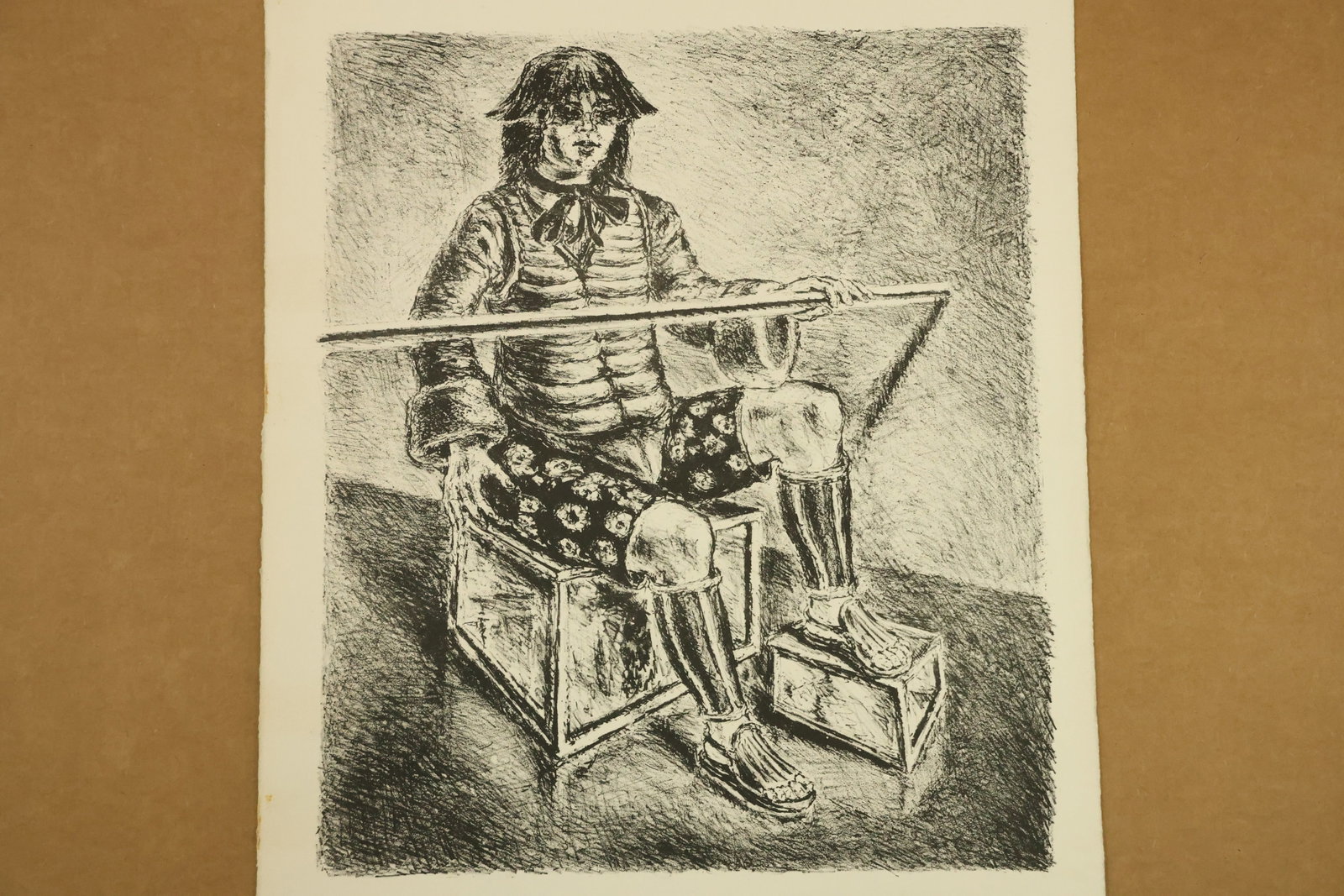 Seated Costumed Figure Monochrome Print Attributed to Peter Passuntino: Monochrome print on paper depicting a seated figure in a dark hat, striped upper garment, patterned shorts and tall boots. A long pole extends across the figure above box shaped supports. Unsigned in 