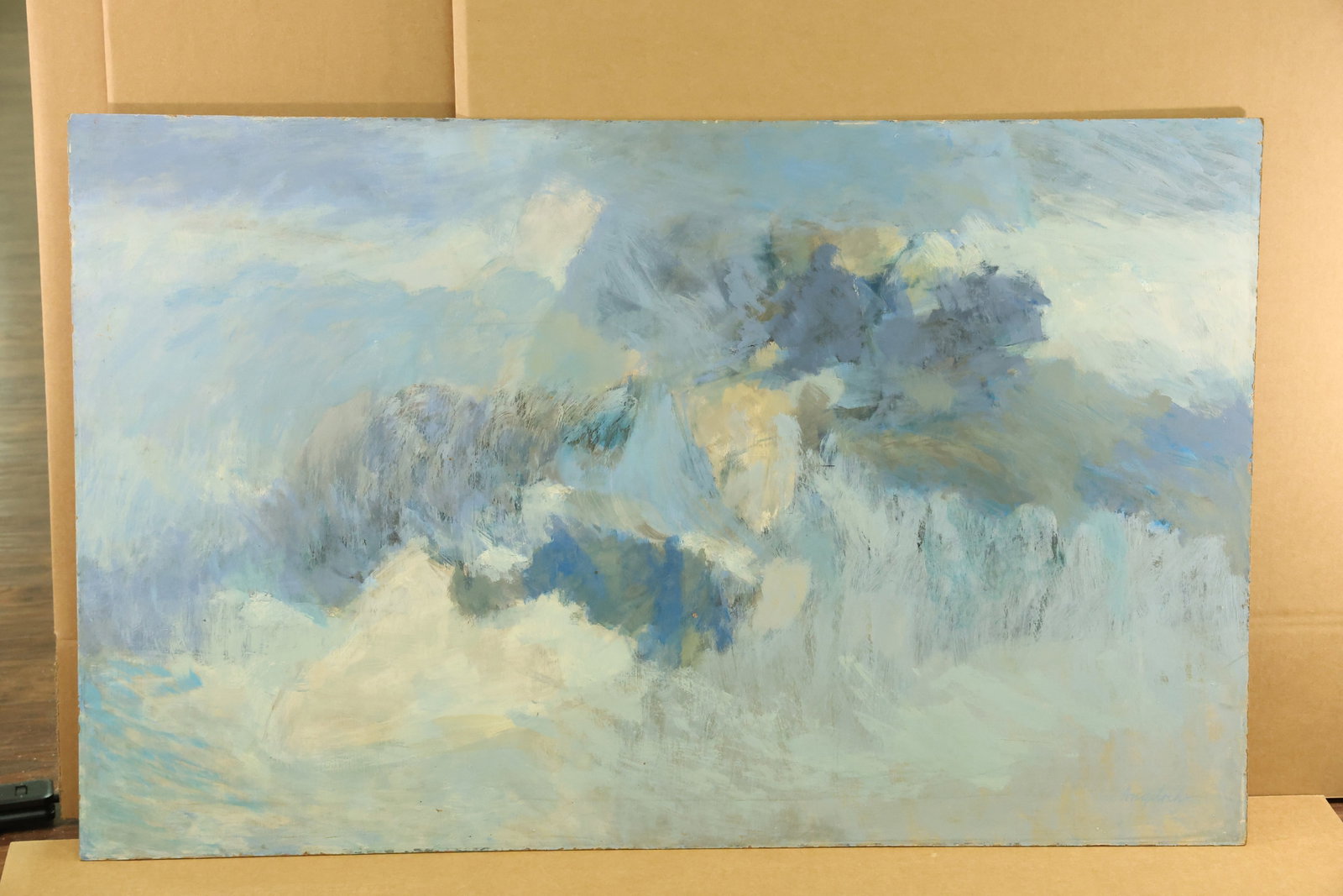 Offshore Marine Painting on Board Signed Angeloch: Horizontal painting on board with pale blue and cream passages surrounding darker blue gray forms. Broken brushwork suggests surf and offshore rocks. Signed Angeloch at the lower right. A reverse labe