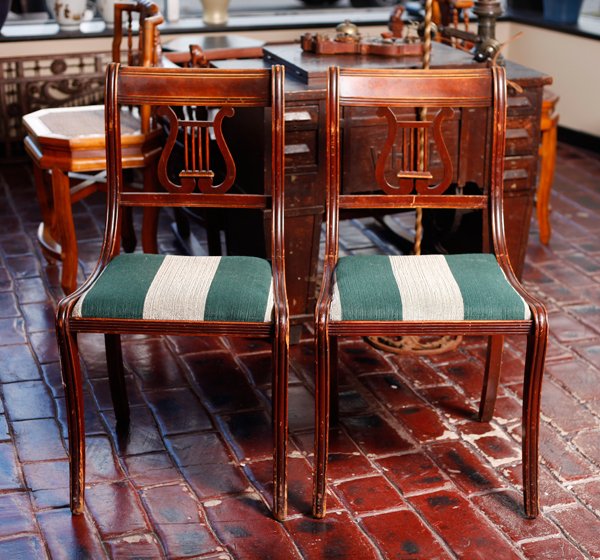 Pair of Duncan Phyfe Lyre Back Chairs: Upholstered in green and gray, with lyre back. 34" H x 18.5" W x 18.5" D. Good condition with wear to finish throughout.